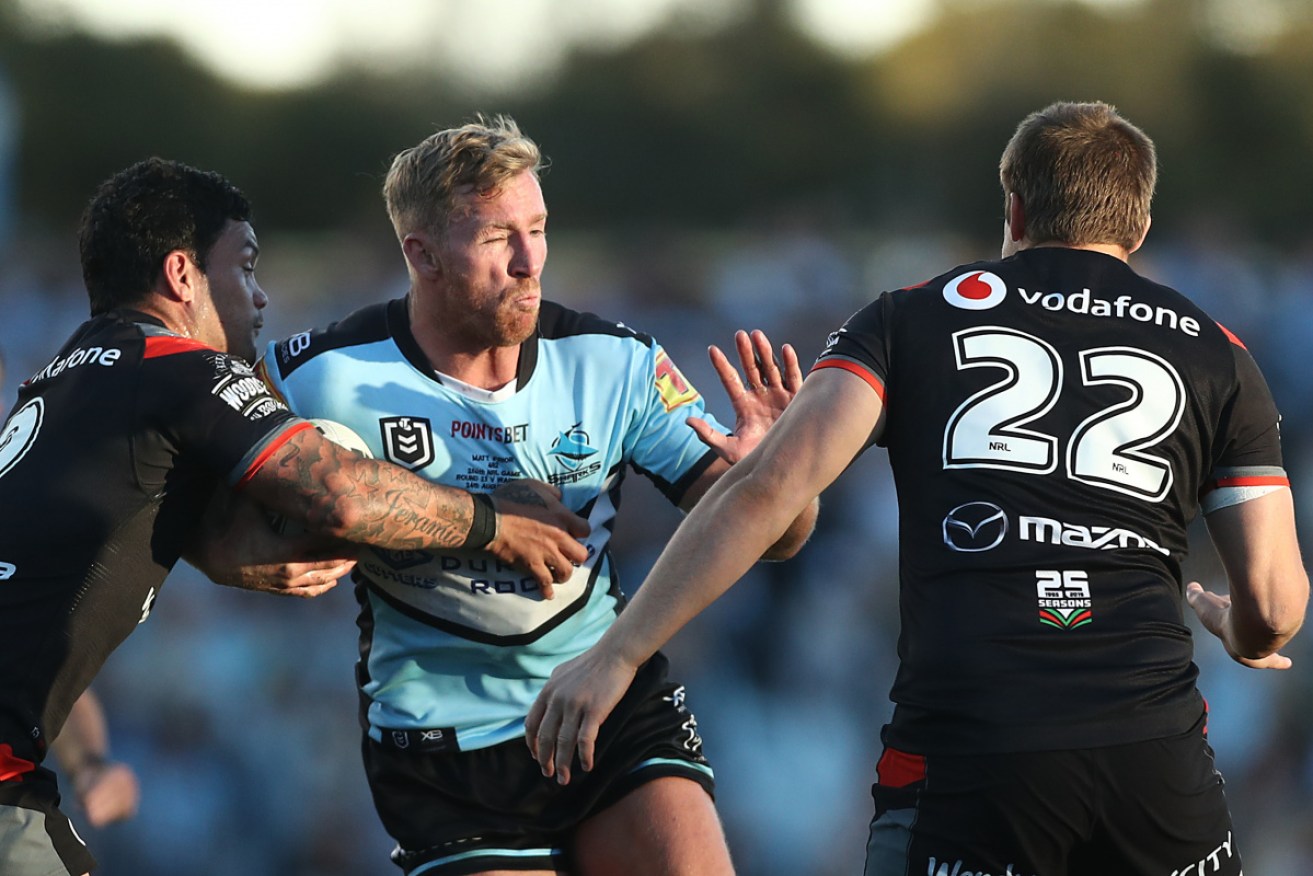 Cronulla's Matt Priortries to force a way through the  defence. 