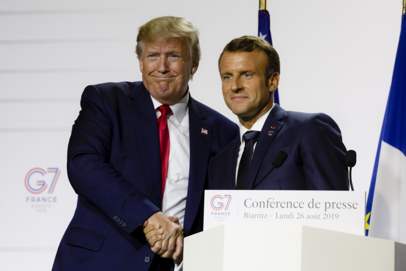 Donald Trump and French President, Emmanuel Macron, shake hands during the final press conference of the G7 Summit. 