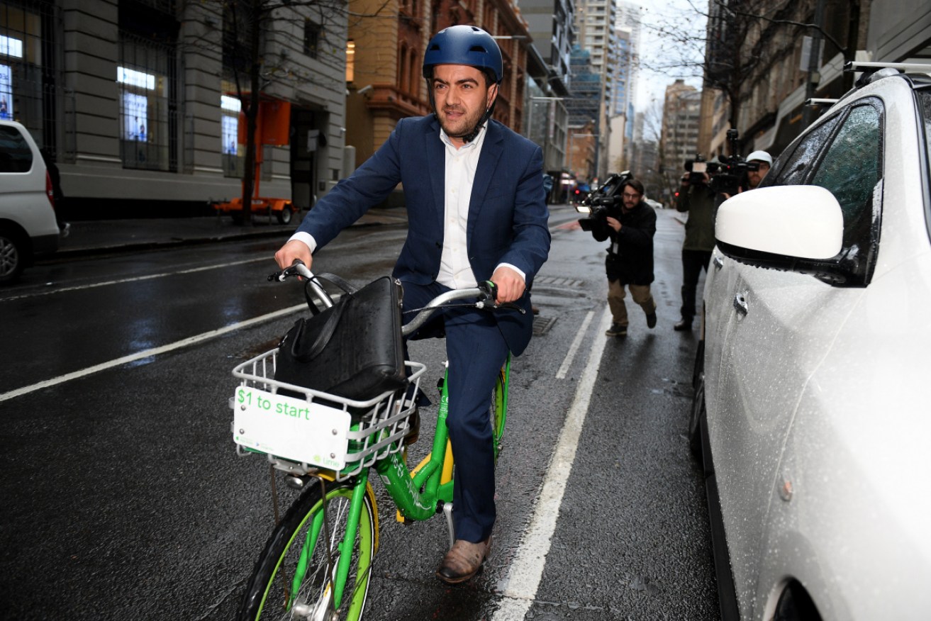 Former Federal Labor Senator Sam Dastyari rode off into Sydney traffic after leaving the ICAC hearing.