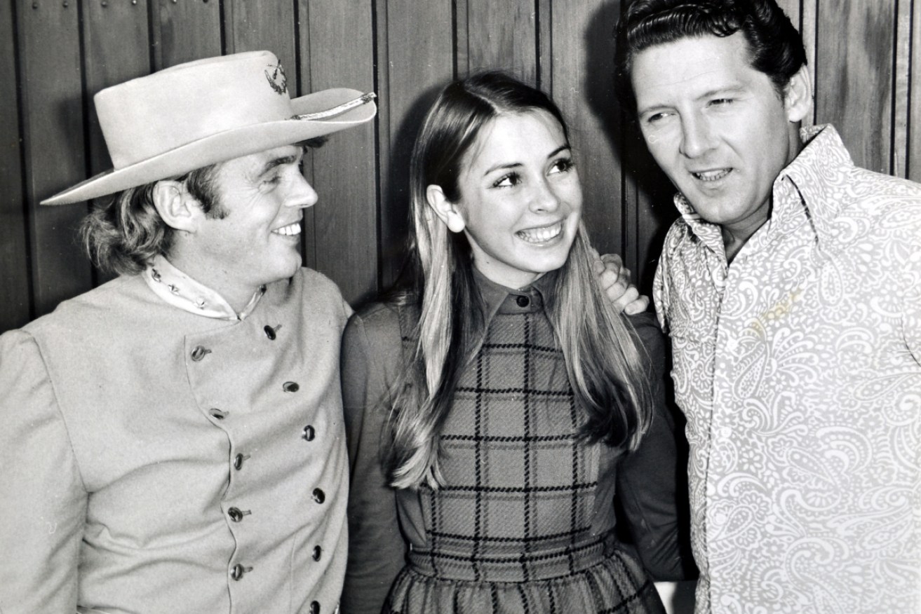 Ward Pally Austin, left, with his wife Irene, whom he courted when she was 14. Here they're meeting rock legend Jerry Lee Lewis who married his 13-year-old cousin.  