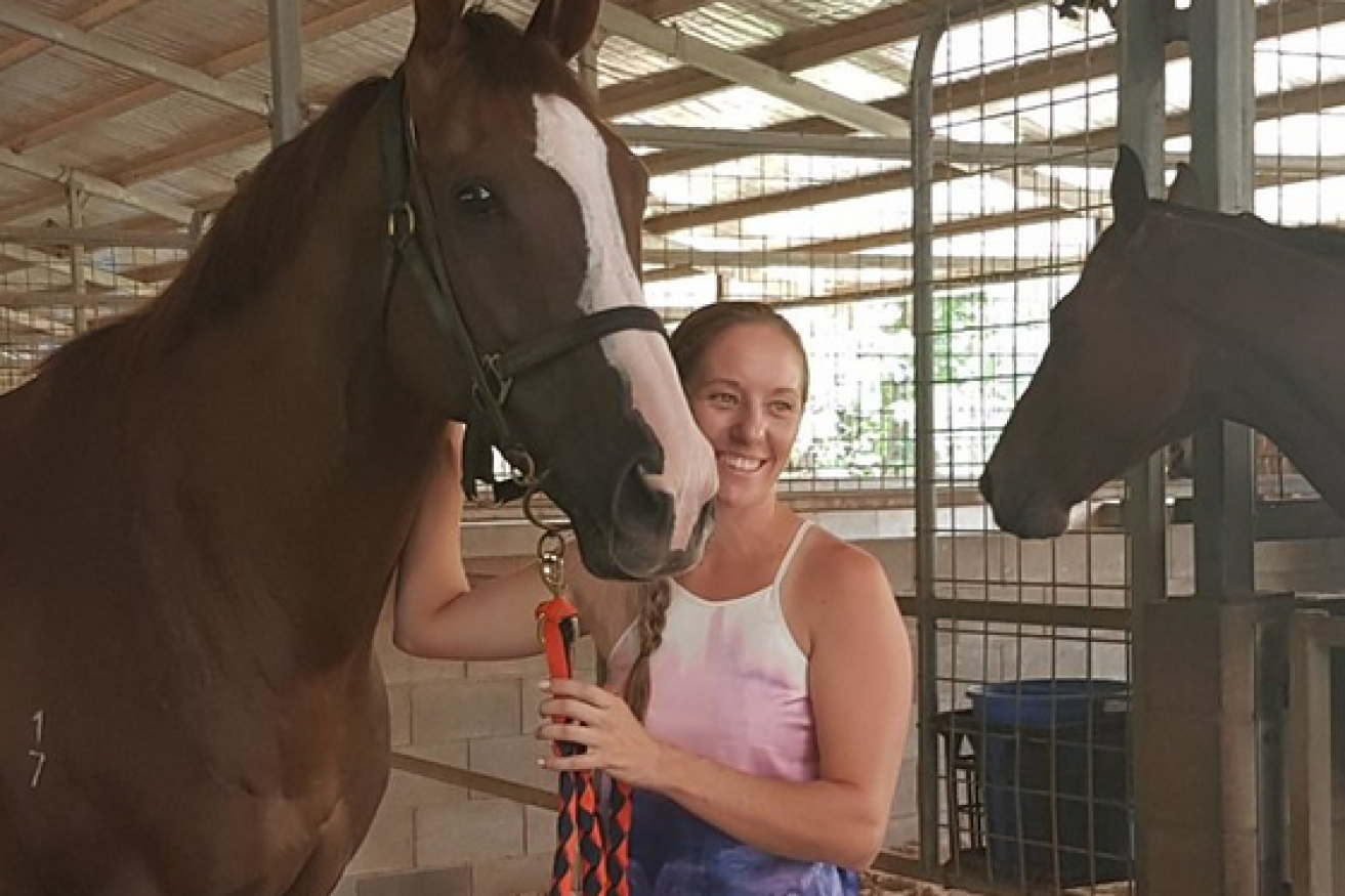 Her horse stumbled and jockey Melanie Tyndall, shown here in 2016 with one of her winning mounts, hit the track hard and died later in hospital. 