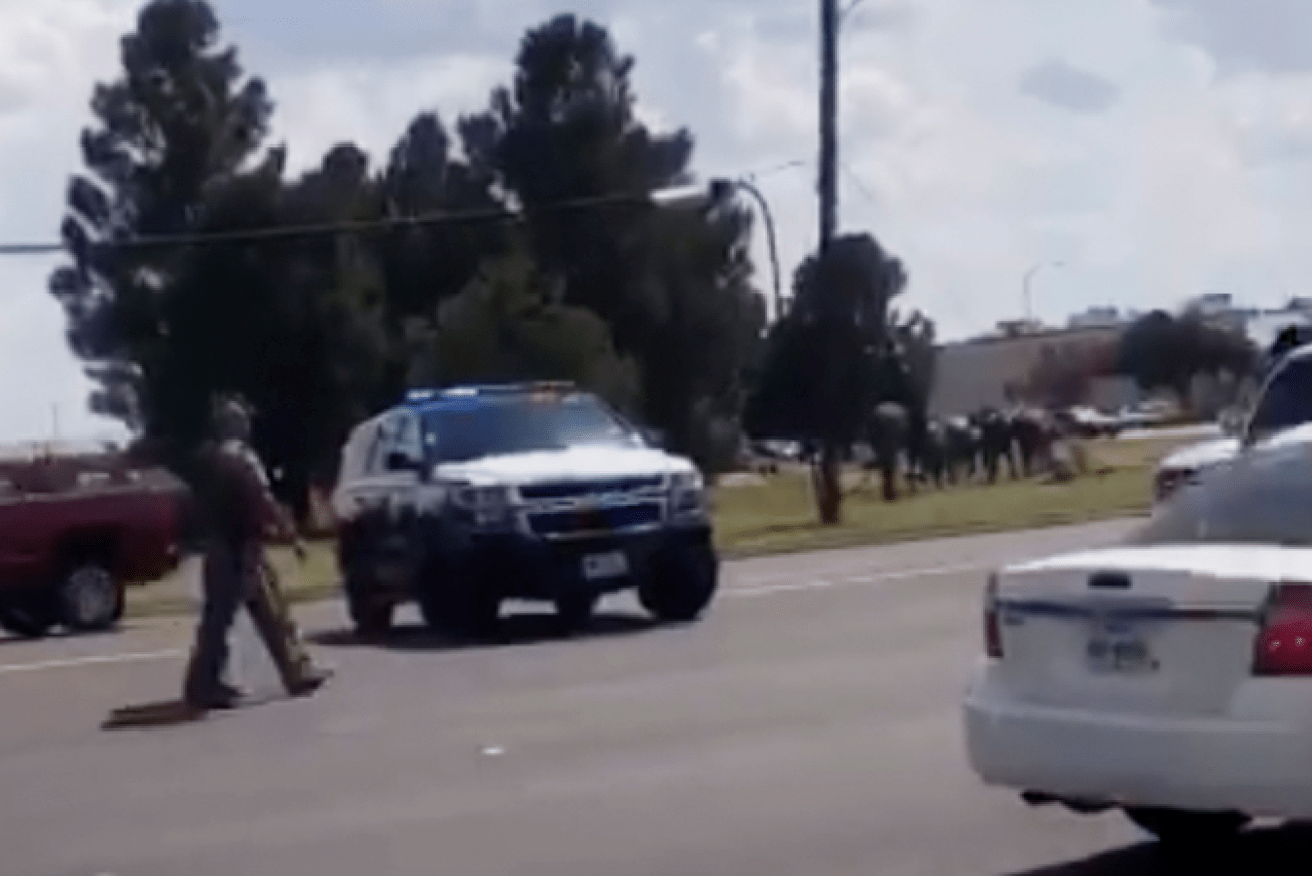 Texas police man a roadblock during the frantic hours the gunman was on the loose.
