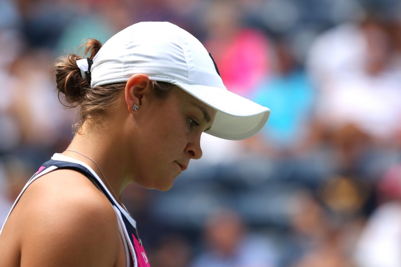 Ash Barty has been defeated by China's Qiang Wang at the US Open.