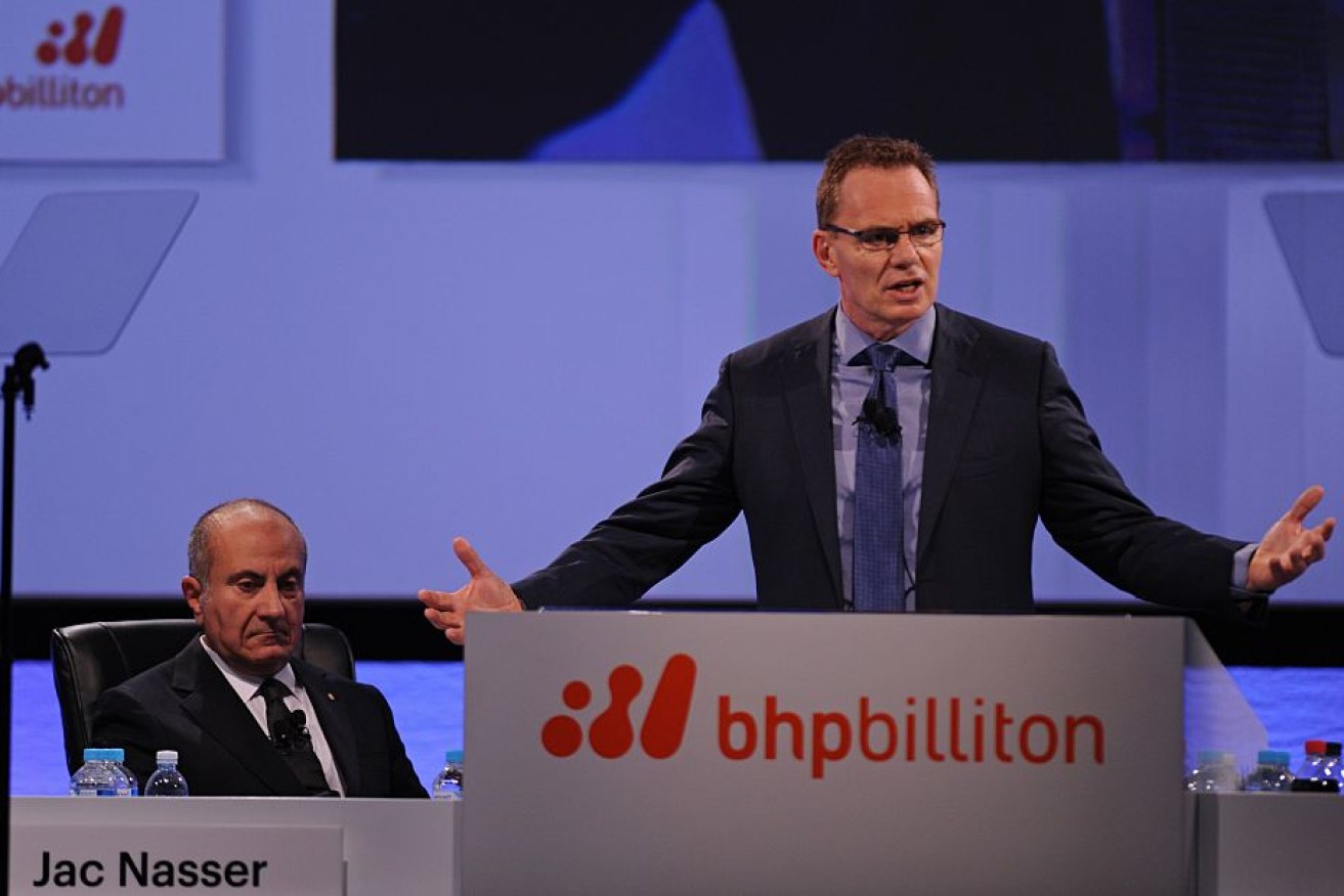 BHP Billiton chairman Jac Nasser (L) and chief executive officer Andrew Mackenzie – the company performed well by cutting costs by 50 per cent.