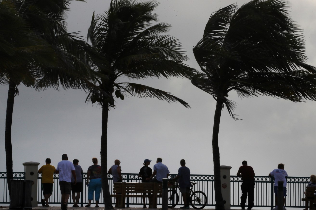 Residents watch the heavy surf during a mandatory evacuation as Hurricane Dorian nears.