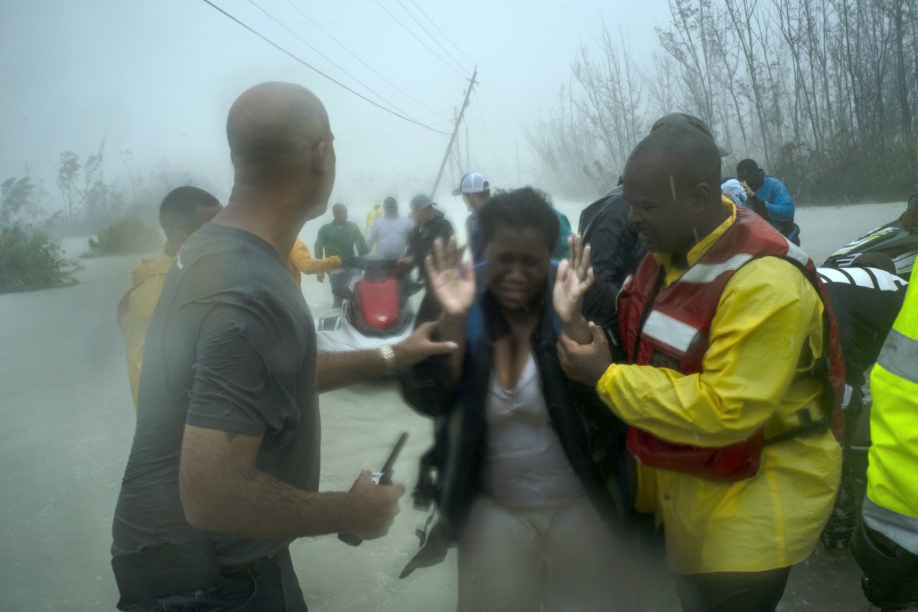 Families are rescued from rising waters in Freeport, Bahamas.