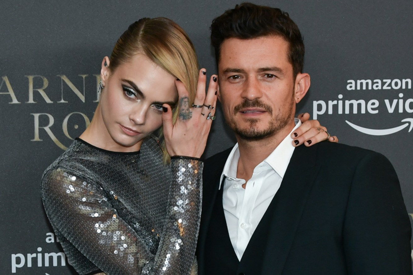 Cara Delevingne with <i>Carnival Row</i> co-star Orlando Bloom in Berlin on August 26.
