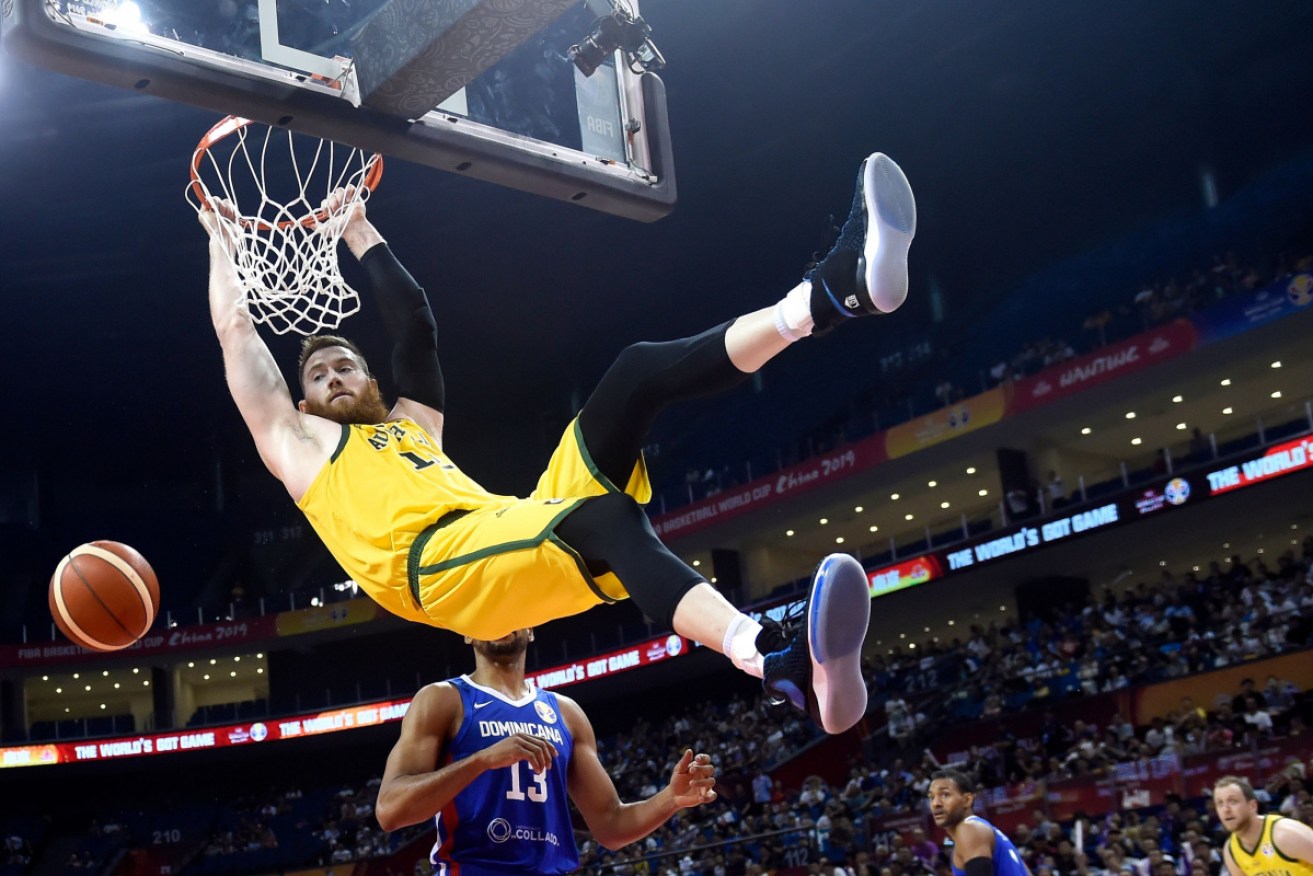 Australia;s Aron Baynes scores in the World Cup match against Dominican Republic.