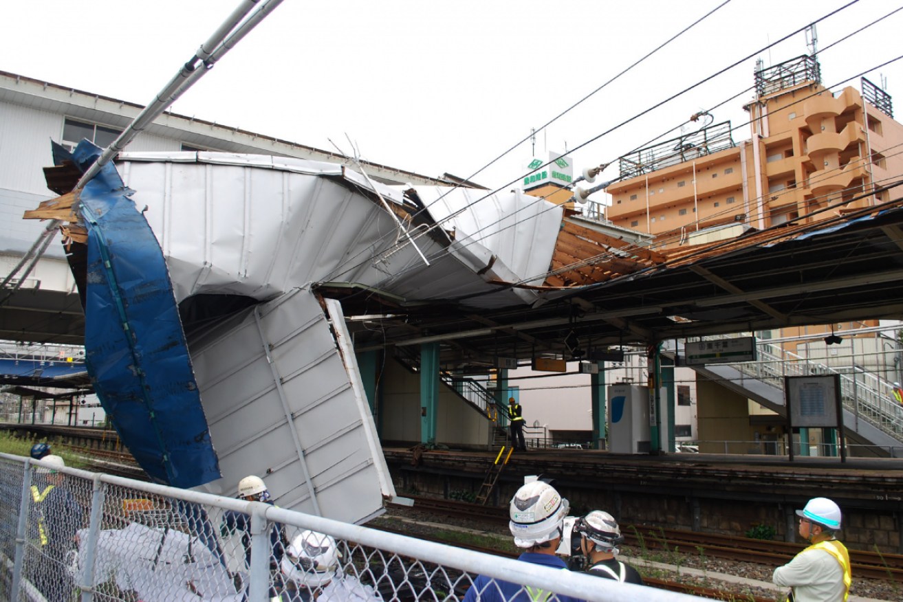 Typhoon Faxai has caused extensive damage, including to the roof of Higashi Chiba station, as potentially record winds and rain battered the Tokyo region.