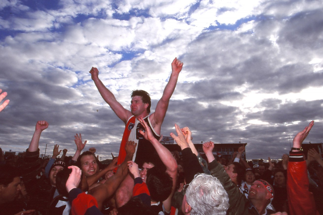 A football man: Danny Frawley was chaired off the ground following his final match for St Kilda in 1995.  
