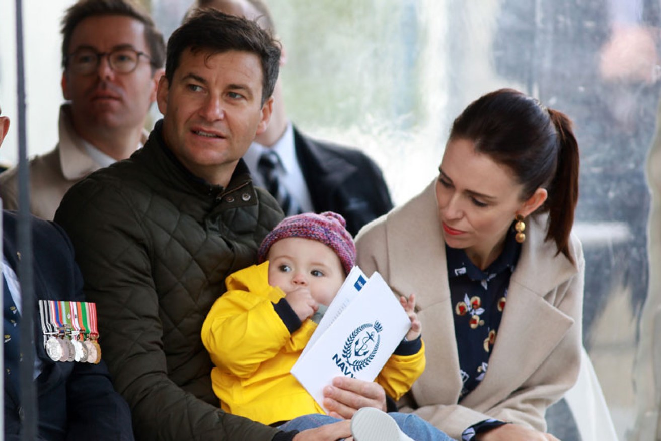 Due to COVID, Jacinda Ardern and Clarke Gayford, shown here with baby Neve, won't be exchanging rings anytime soon. <i>Photo: Getty</i>