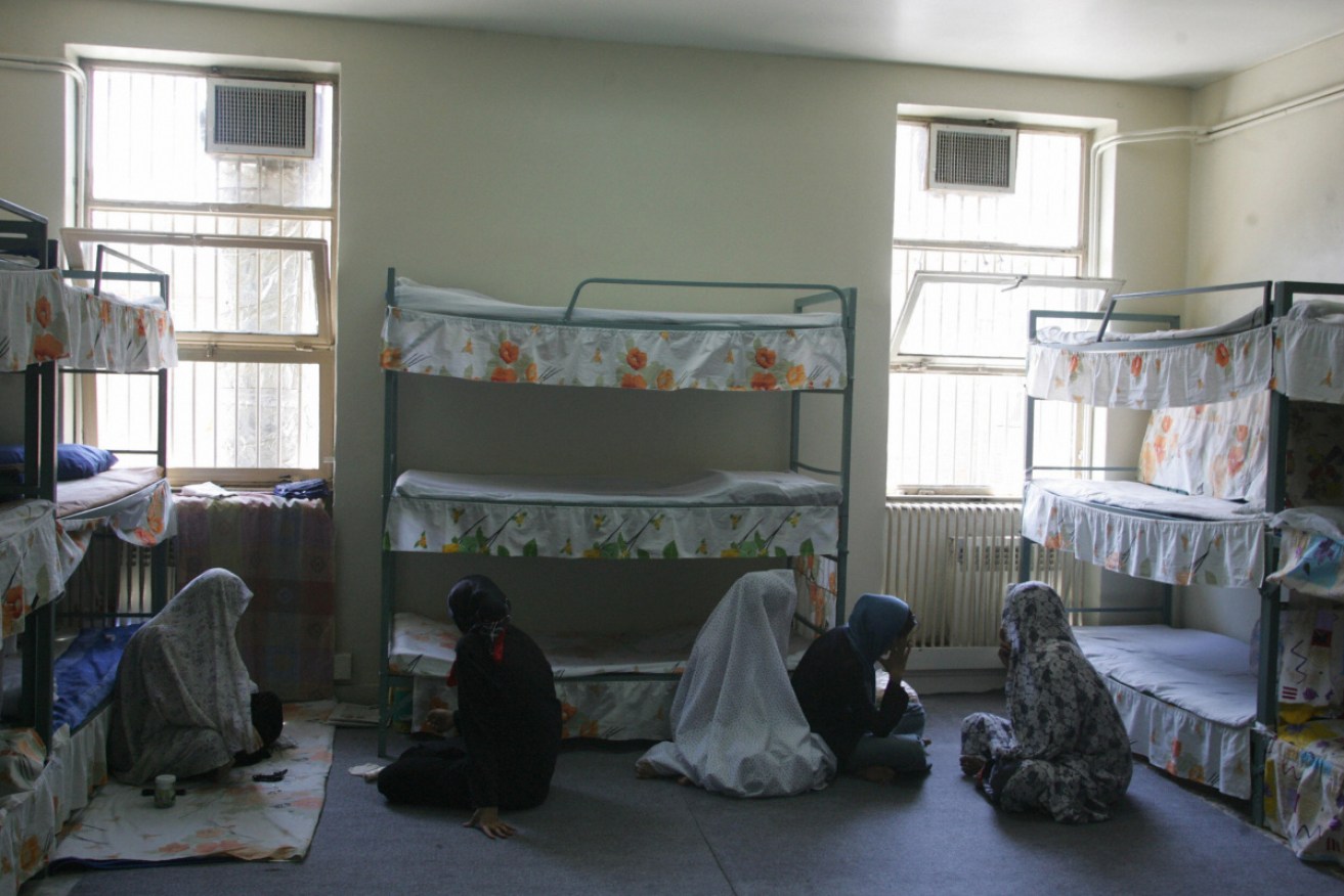 Female inmates sit at their cell in the Evin jail in Tehran, Iran.