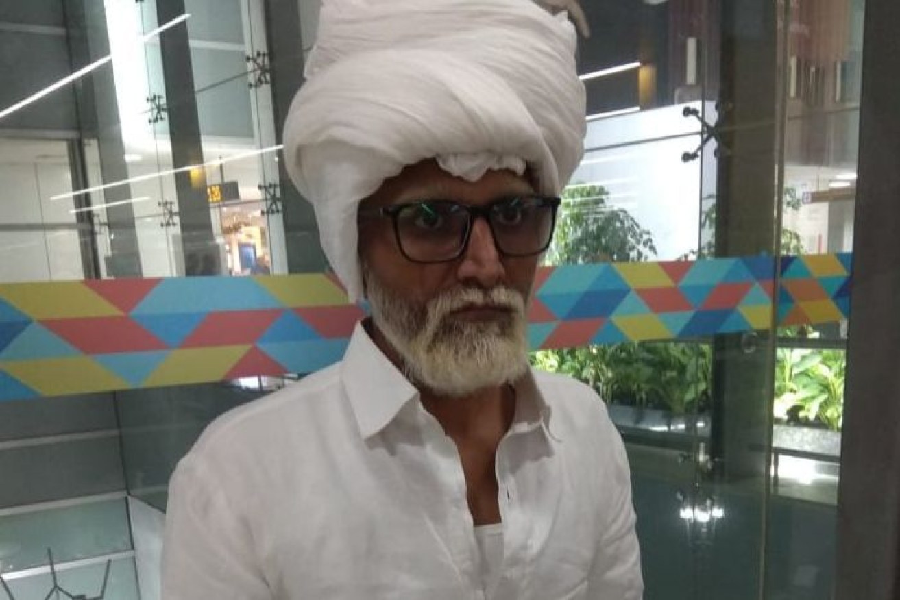 Jayesh Patel arrived at New Delhi's Ghandi International Airport on a wheelchair.