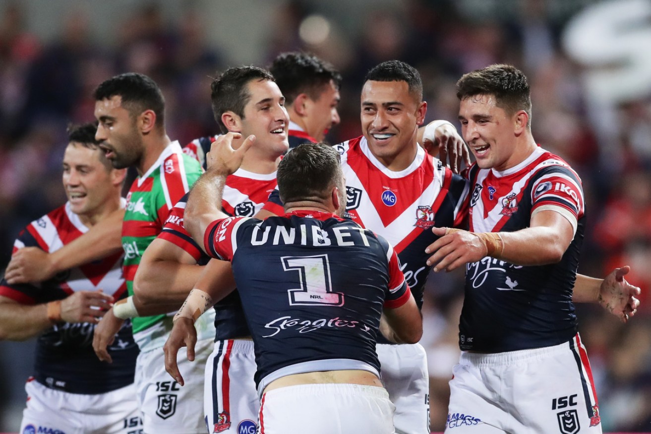 The Roosters congratulate Sio Siua Taukeiaho after a try. Photo: Getty 