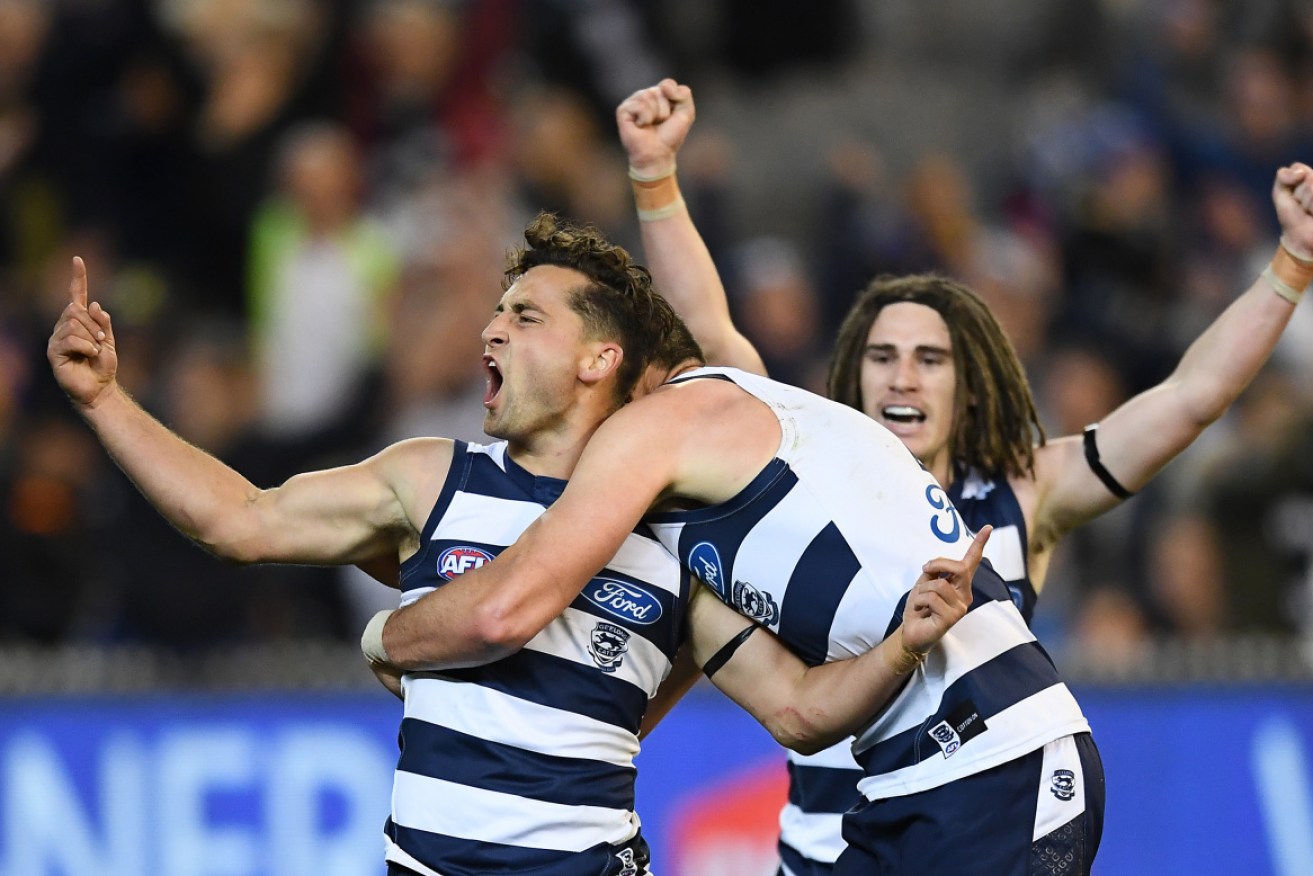That preliminary final feeling: Geelong players celebrate their win over the Eagles. 