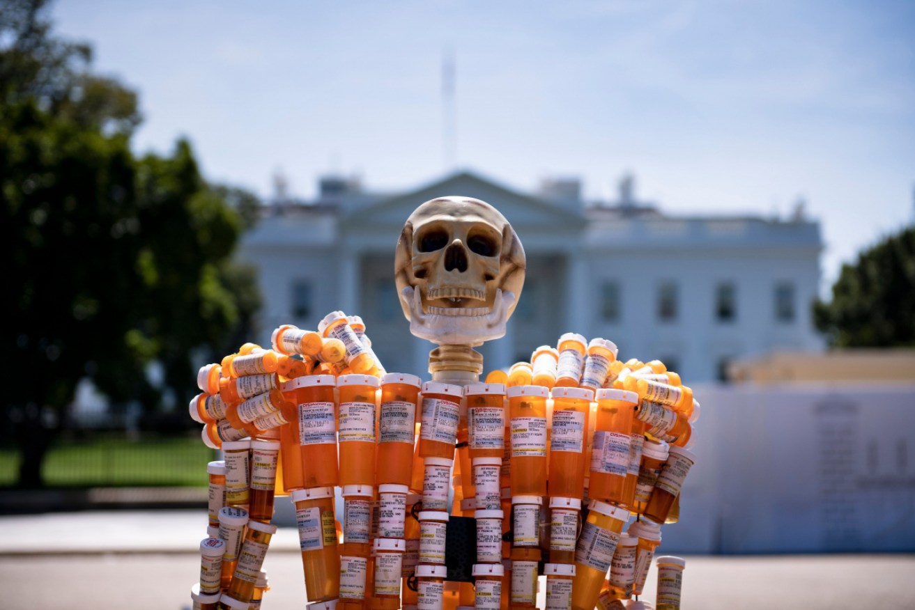 Pill Man, a skeleton made from one man's oxycontin and methadone prescription bottles, is seen on Pennsylvania Avenue in front of the White House.