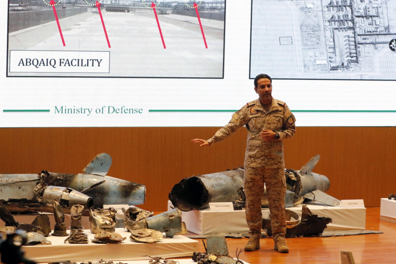 Saudi Defense Ministry spokesman Colonel Turki Al-Malik showcases the remains of missiles allegedly used in an attack against its Aramco oil facility.
