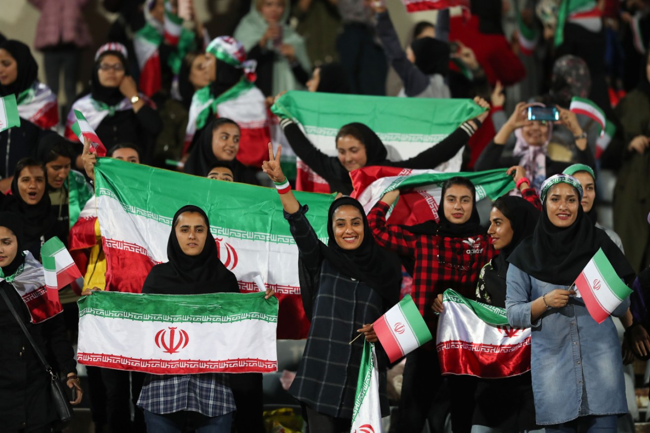 Iranian women support their national side against Bolivia at Tehran in October.
