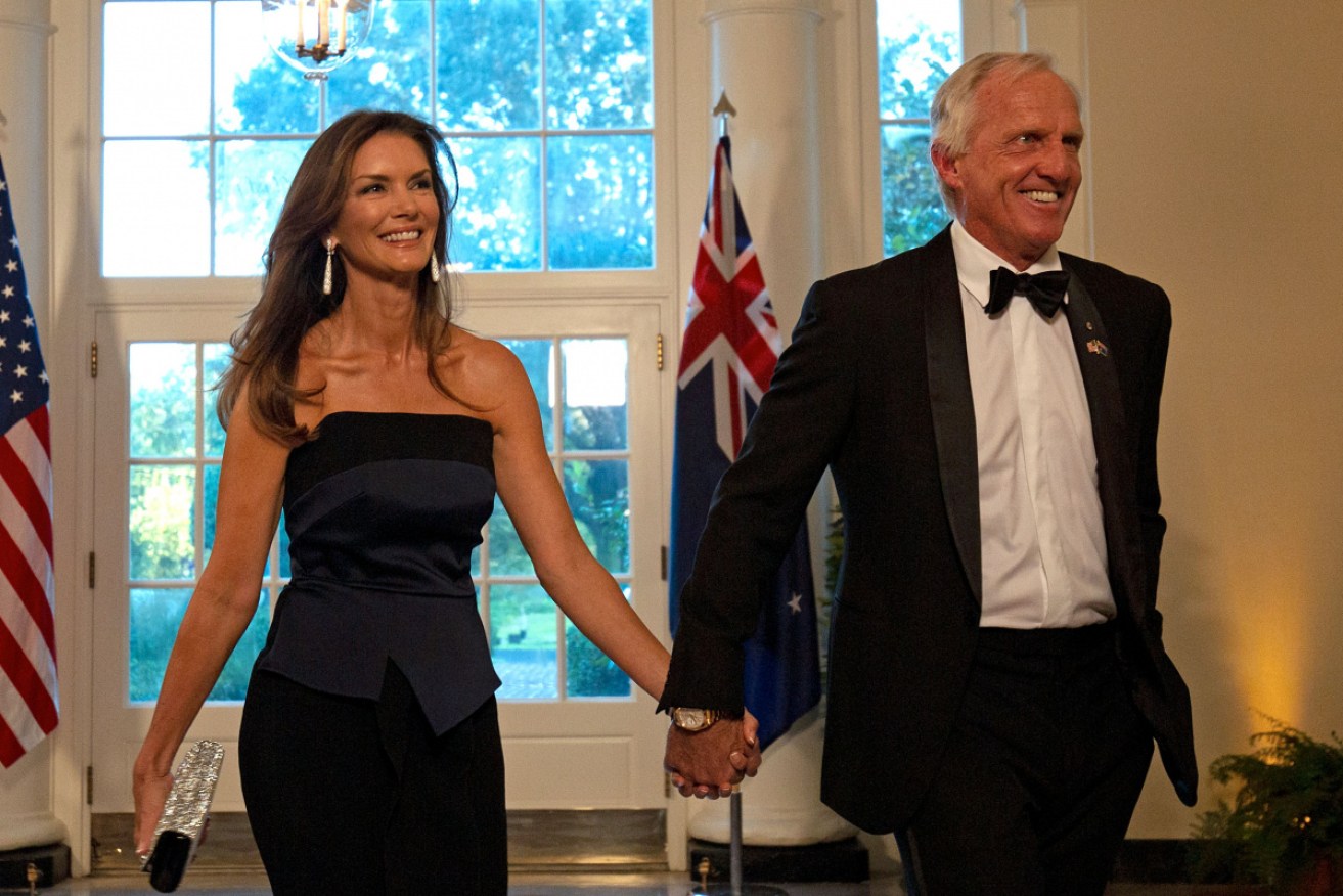 Greg Norman and his wife Kirsten arrive in the Bookseller's area of the White House on their way to the Rose Garden.