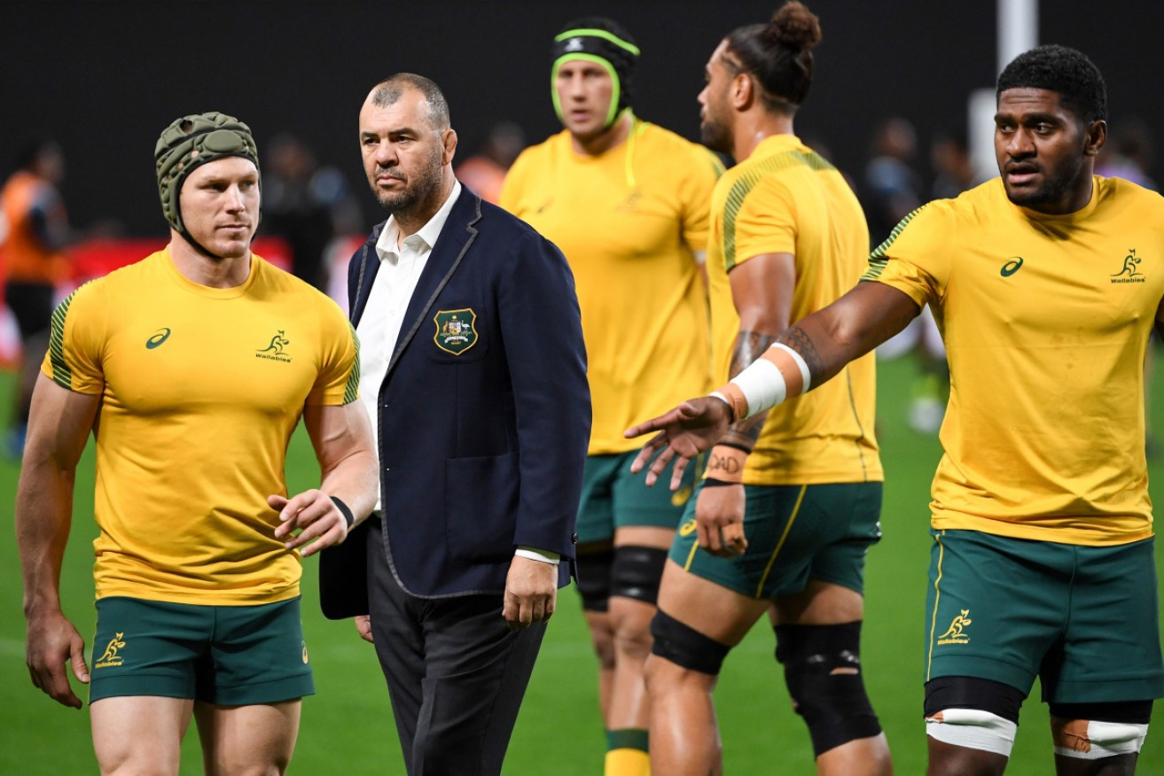 Wallabies coach Michael Cheika with his players before the game against Fiji. 