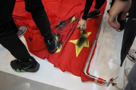 Hong Kong protesters trample Chinese flag