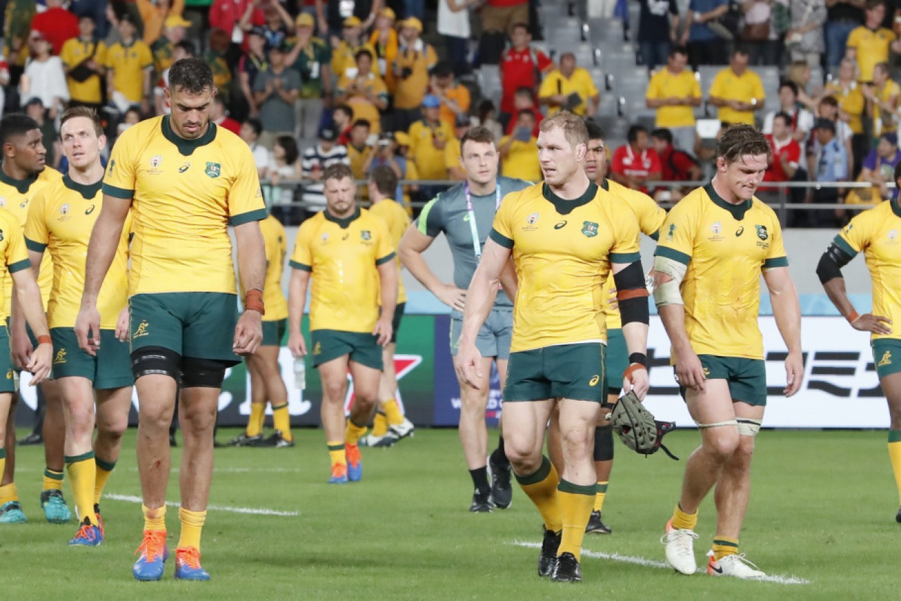 The defeated Wallabies leave the field after losing to Wales. 