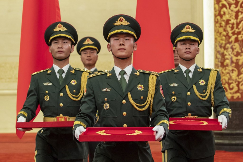 China's military mite will be on display on Tuesday.