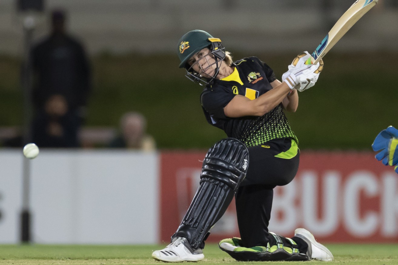 Australia's Erin Burns hits the winning runs against Sri Lanka women at North Sydney Oval on Monday. 
