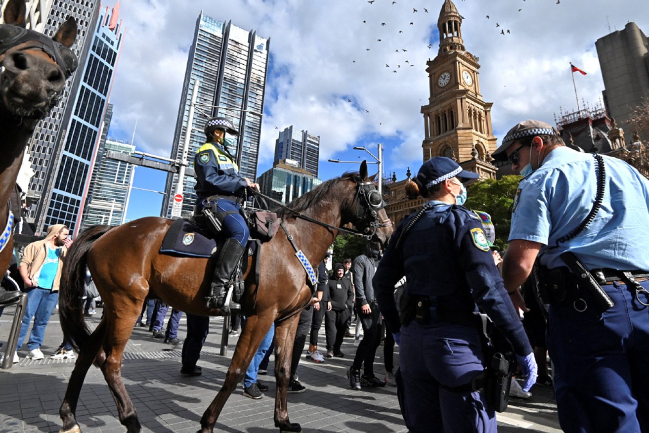 A man accused of assaulting police at an anti-lockdown rally has been lectured before being bailed.
