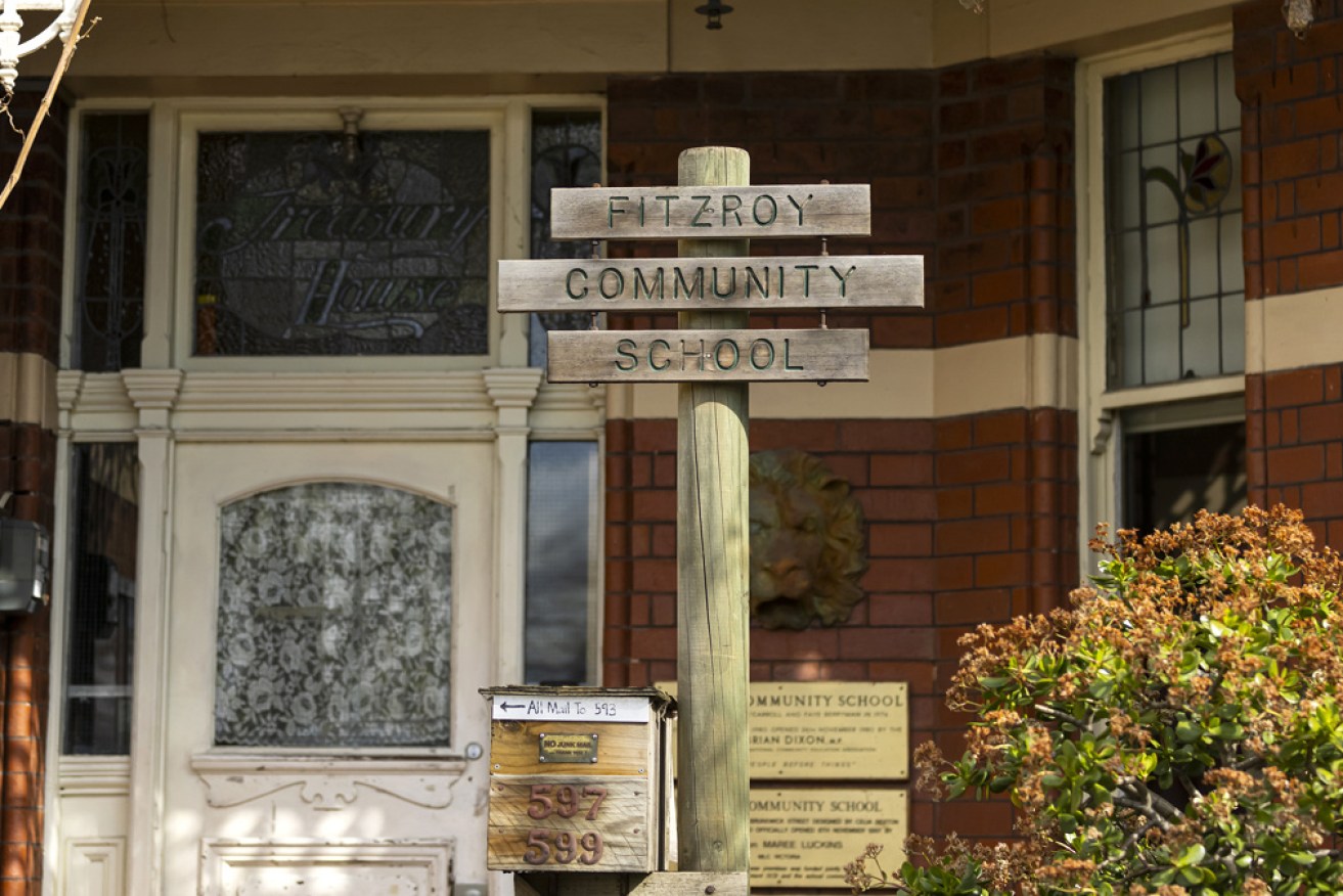 The principal of the Fitzroy Community School has been suspended over a virus outbreak.