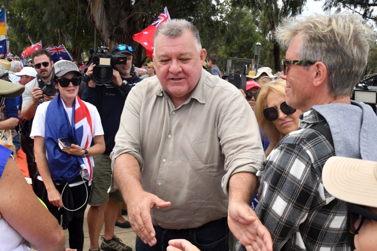 Craig Kelly pictured earlier in the week at anti-vaccination mandate protest outside parliament.