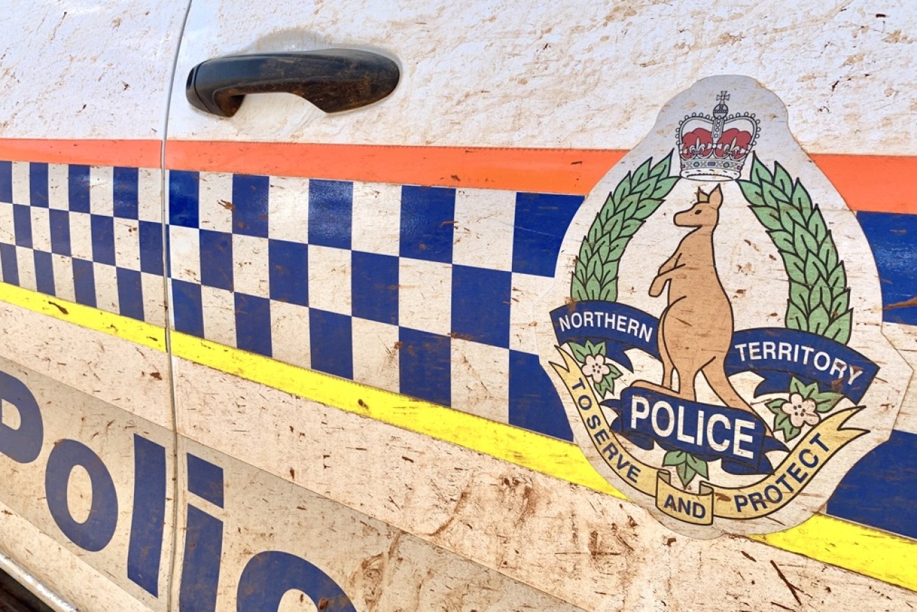A falling tree branch has killed a woman and injured a man in Darwin.