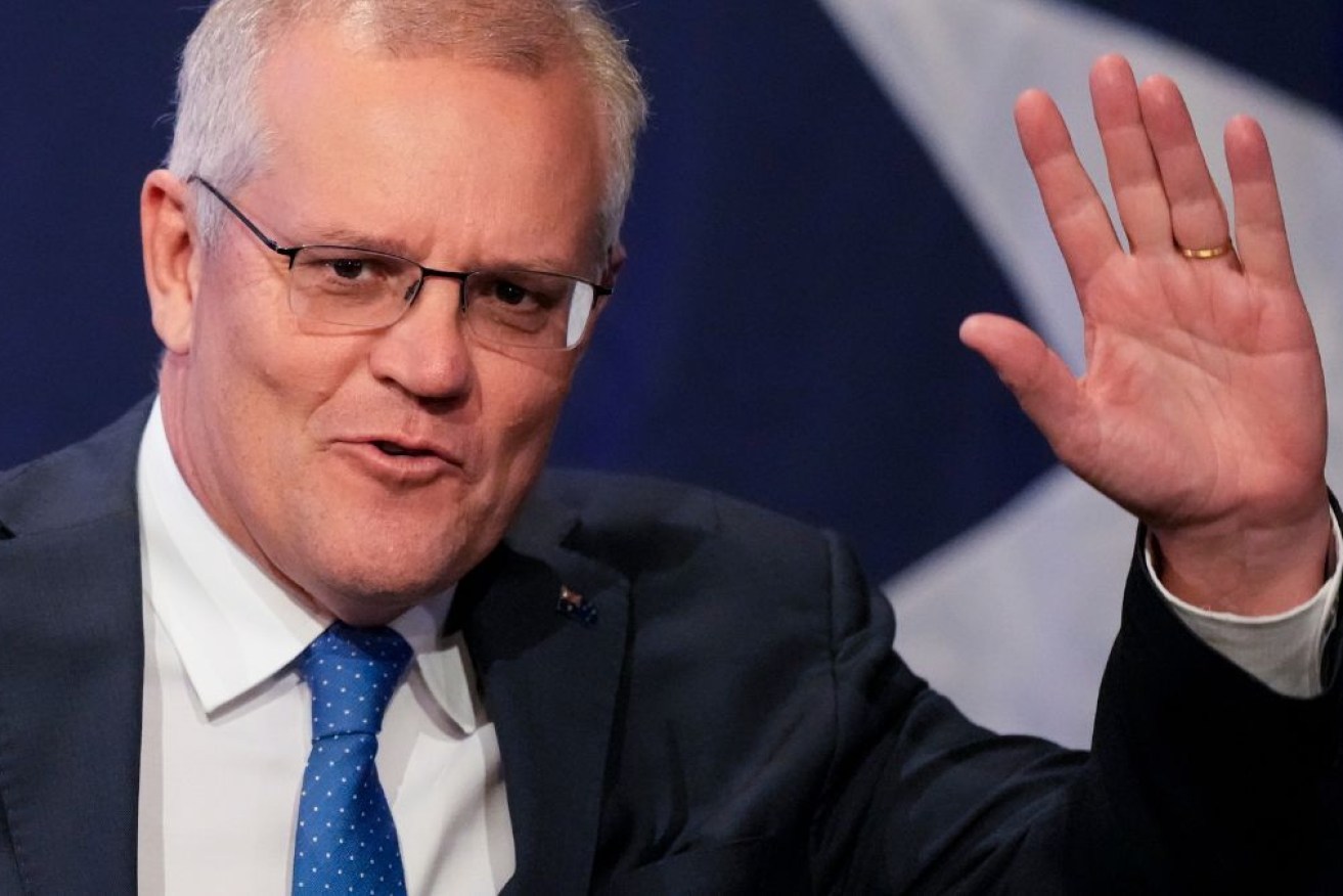 Scott Morrison shows off his Taylor Swift bracelet during his valedictory speech in parliament.