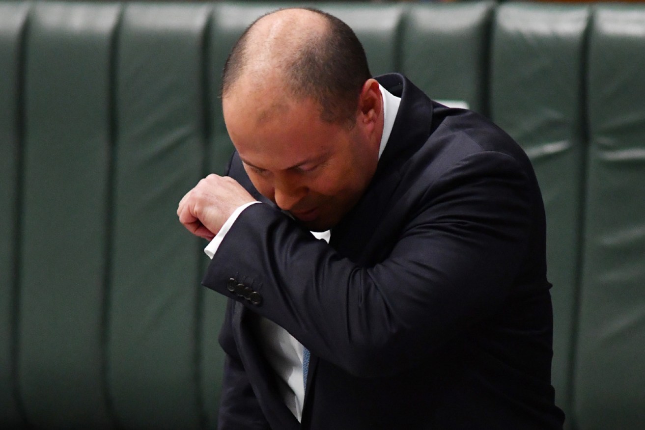 Treasurer Josh Frydenberg struggled through a coughing fit while making a speech on Tuesday. 