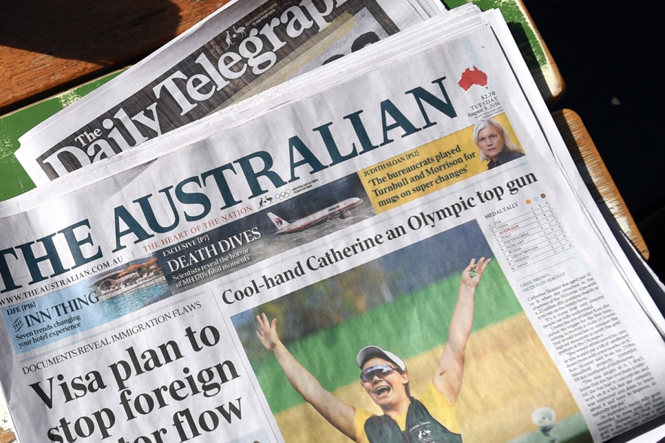 News Corp remains upbeat about the media firm's future despite a large drop in profitability