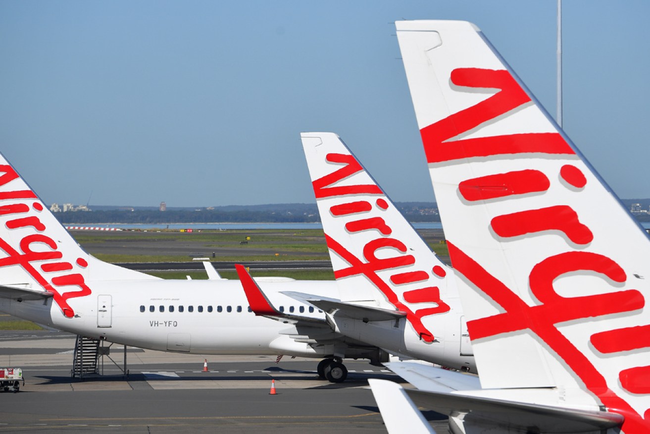 Virgin Australia will slash a third of its workforce as it looks to re-emerge from voluntary administration, but its boss says it won't go downmarket.