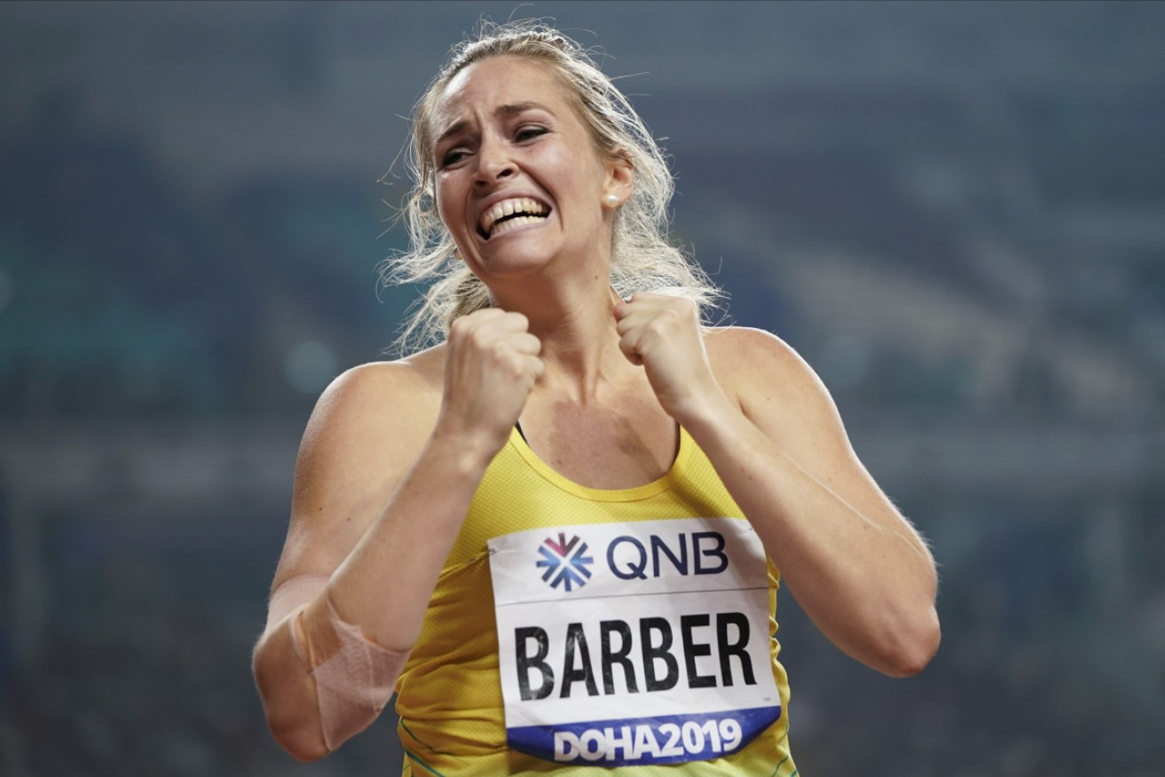 A huge final-round throw has earned Kelsey-Lee Barber the gold medal in the women's javelin at the world championships.