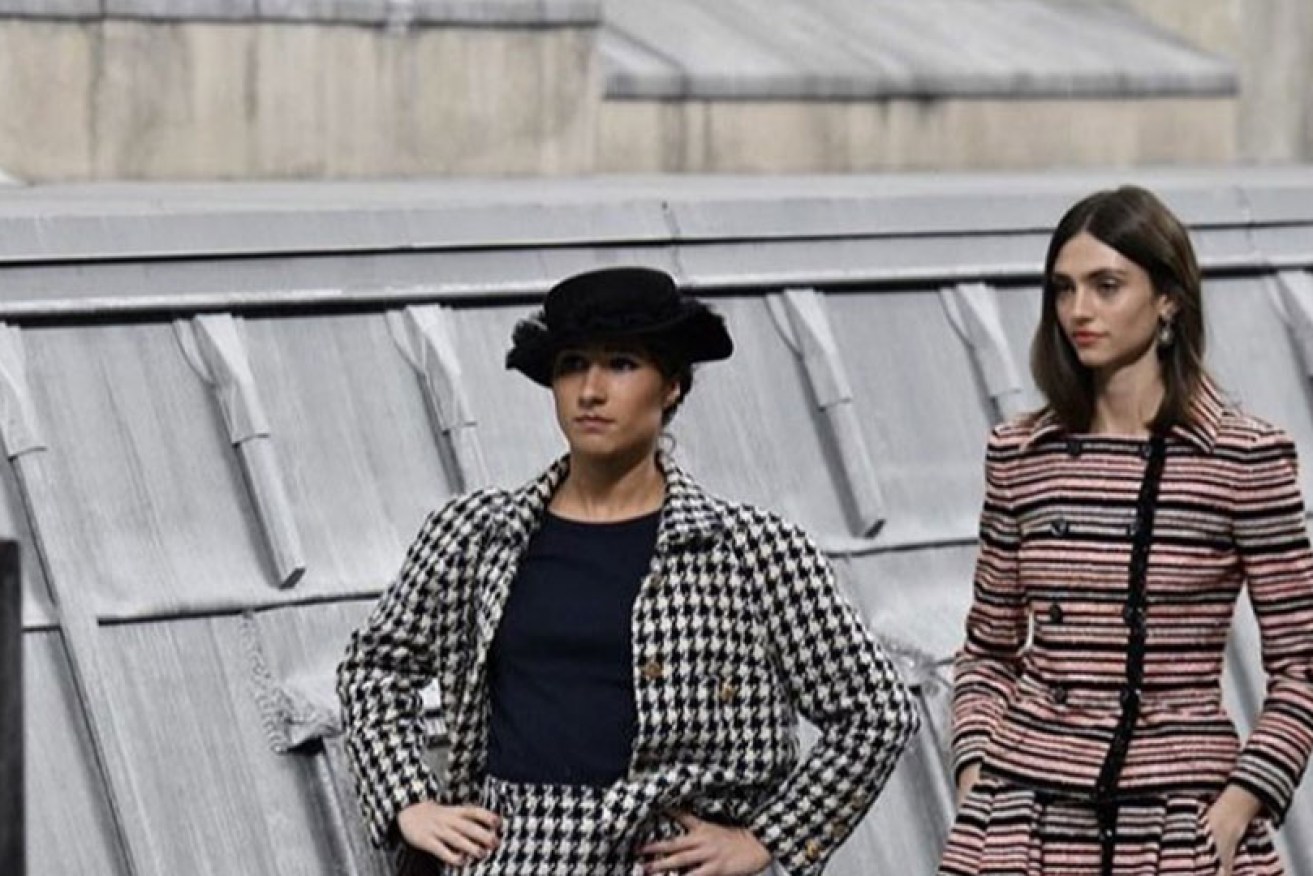 Marie Benoliel (left) invades the catwalk at Chanel's Paris Fashion Week show on October 1.