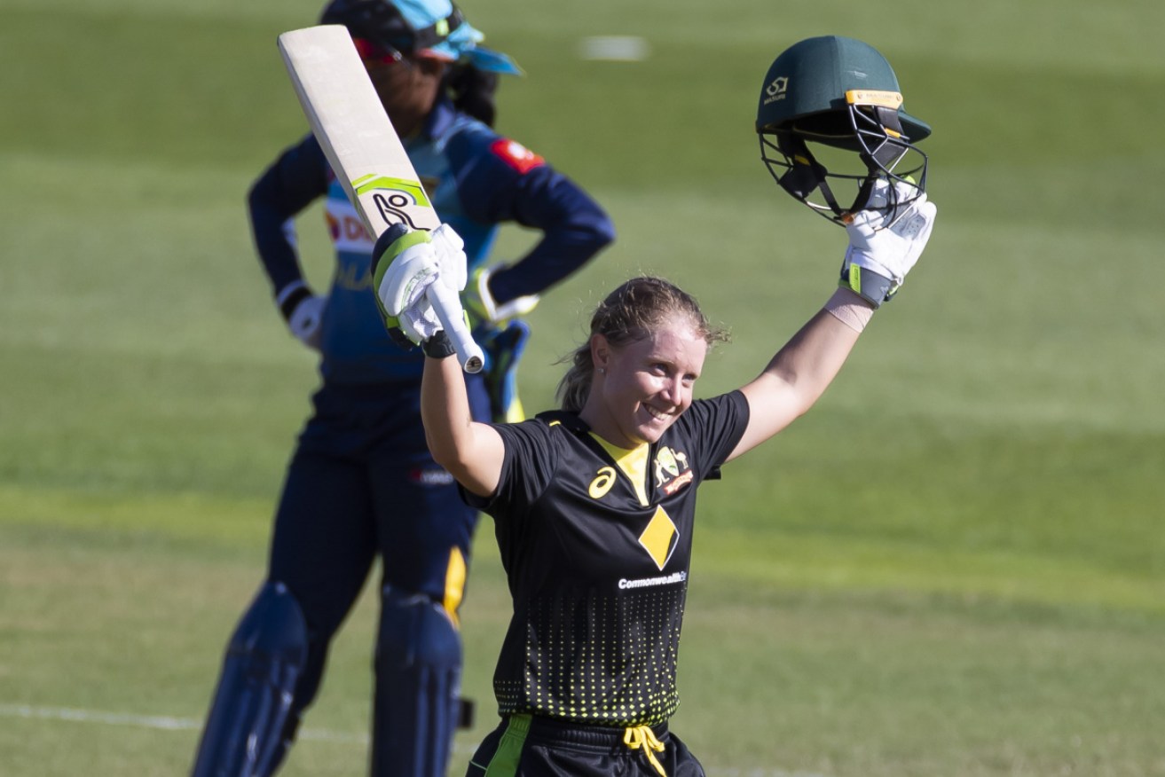 Alyssa Healy acknowledges the crowd after bringing up her century on Wednesday. 