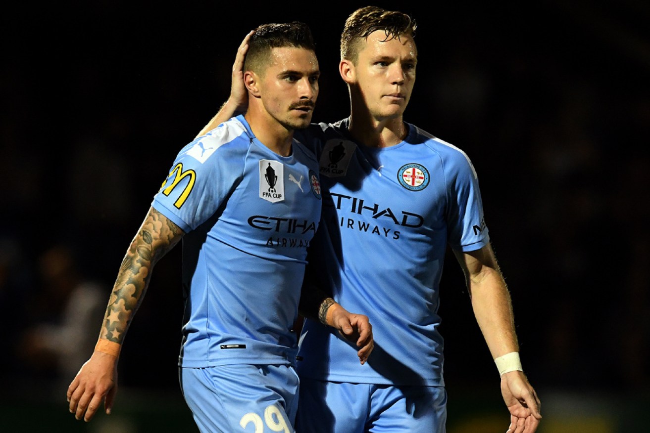 Jamie Maclaren, with Melbourne City teammate Scott Galloway on Tuesday, has been cleared of a serious knee injury.  