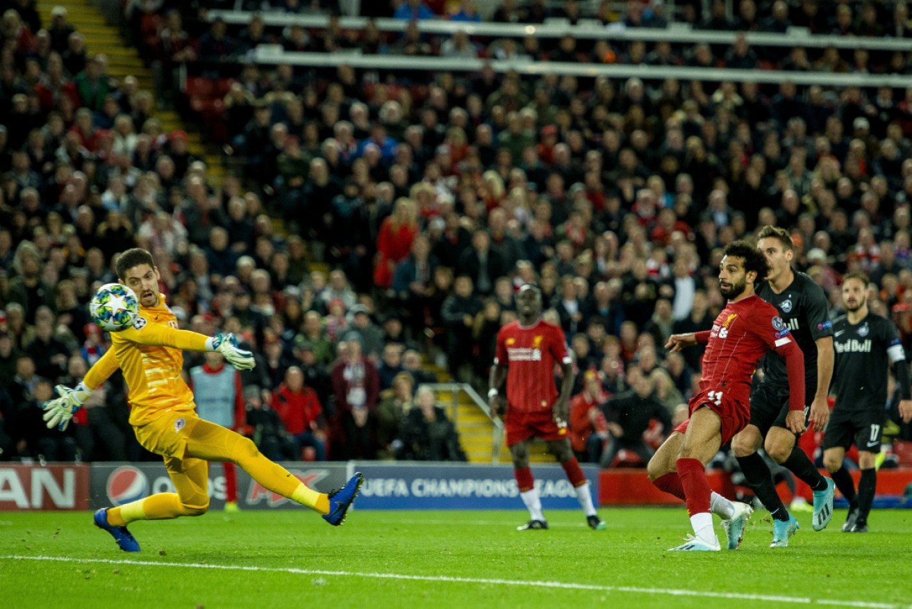 Liverpool's Mohamed Salah scores his side's fourth goal against FC Salzburg.