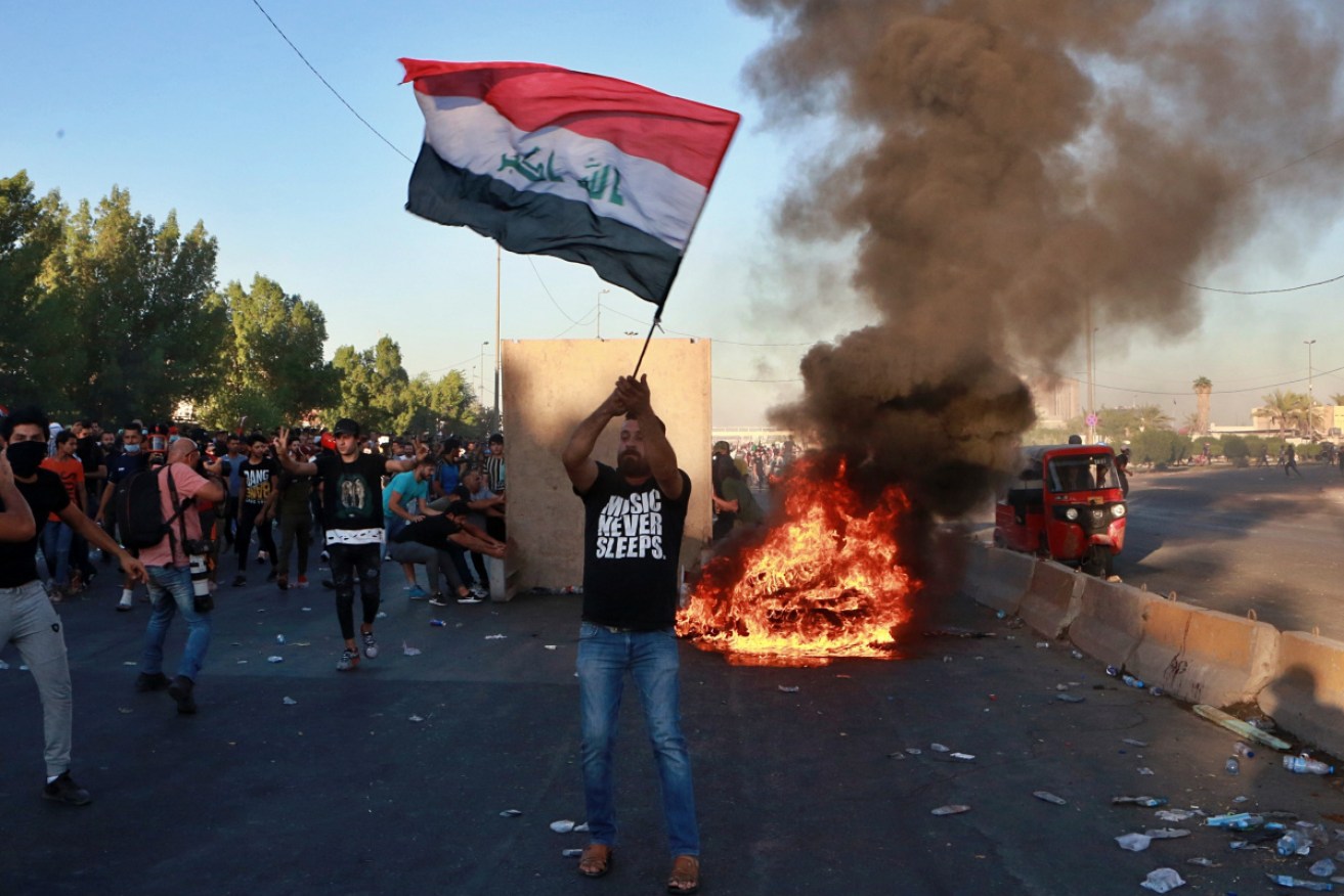 Iraqi security forces opened fire at hundreds of protesters in central Baghdad.