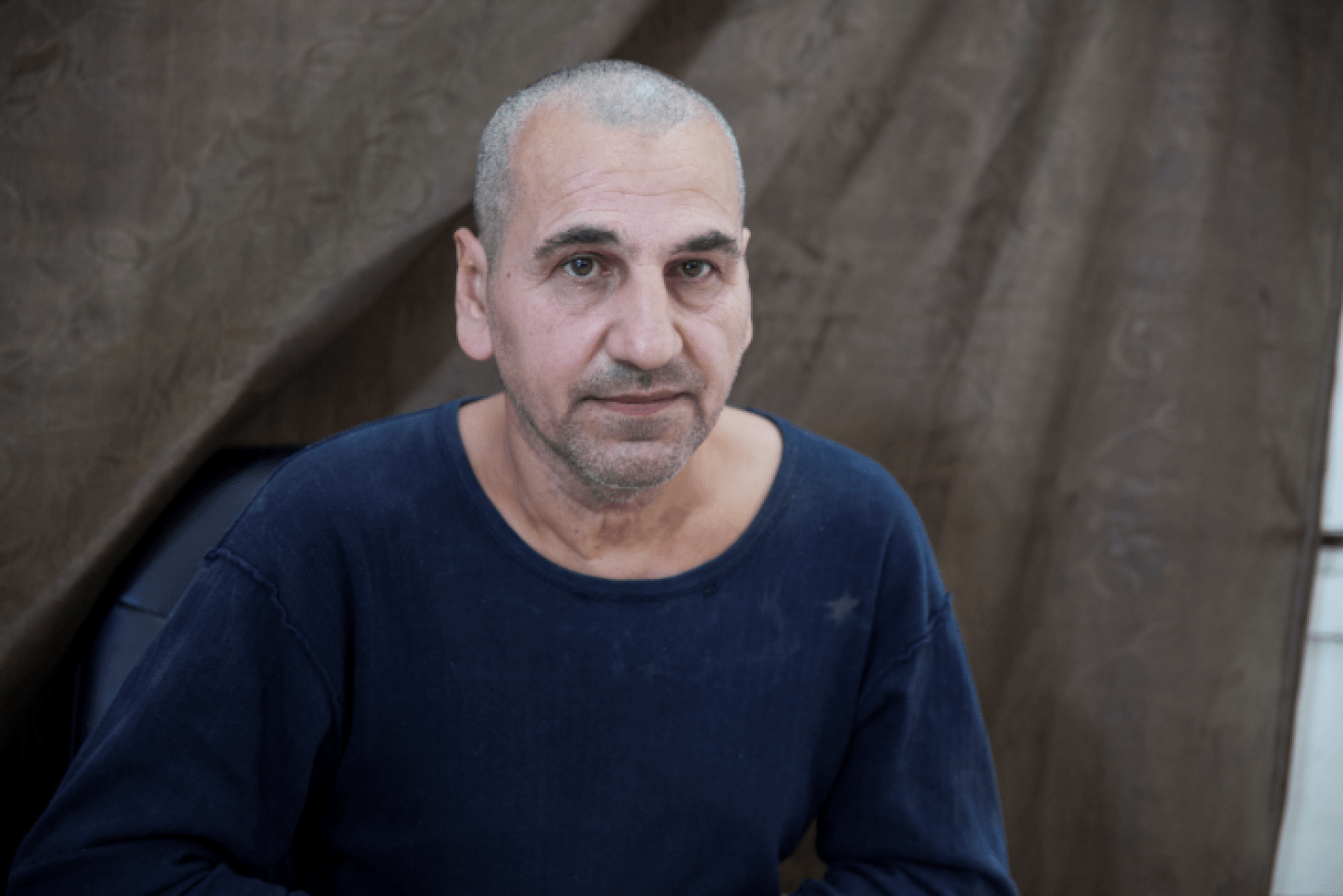 Gaunt and uncertain of his future, Ahmad Assad languishes in a Syrian prison.