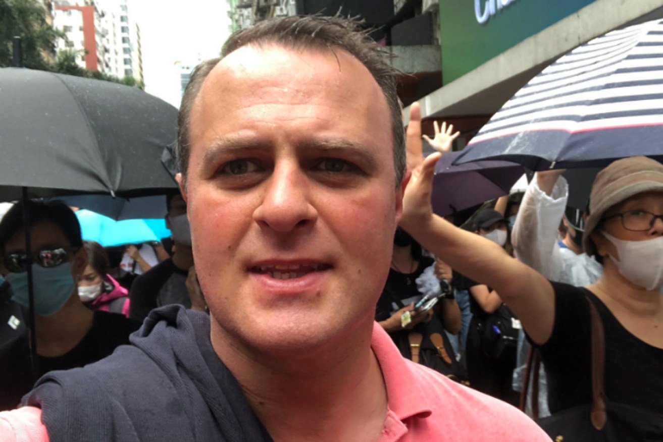 Tim Wilson marches with Hong Kong protesters on Sunday.