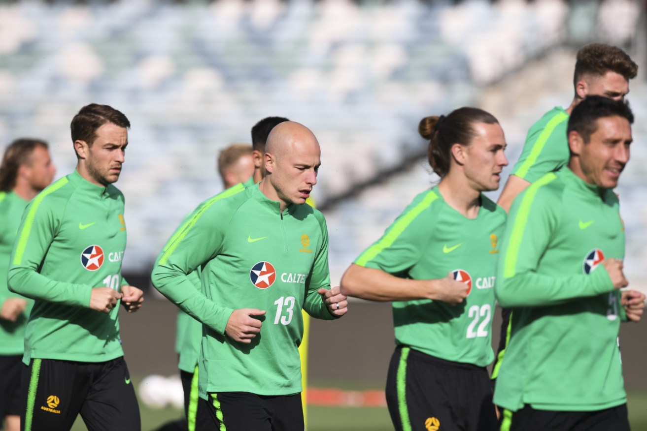 Aaron Mooy prepares for the World Cup qualifier against Nepal with Socceroos teammates in Canberra on Wednesday.