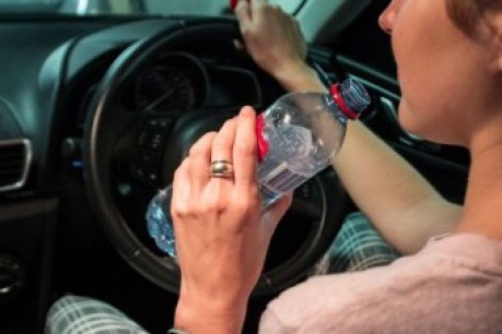 Drinking water at the wheel on 39-degree day lands driver a hefty fine
