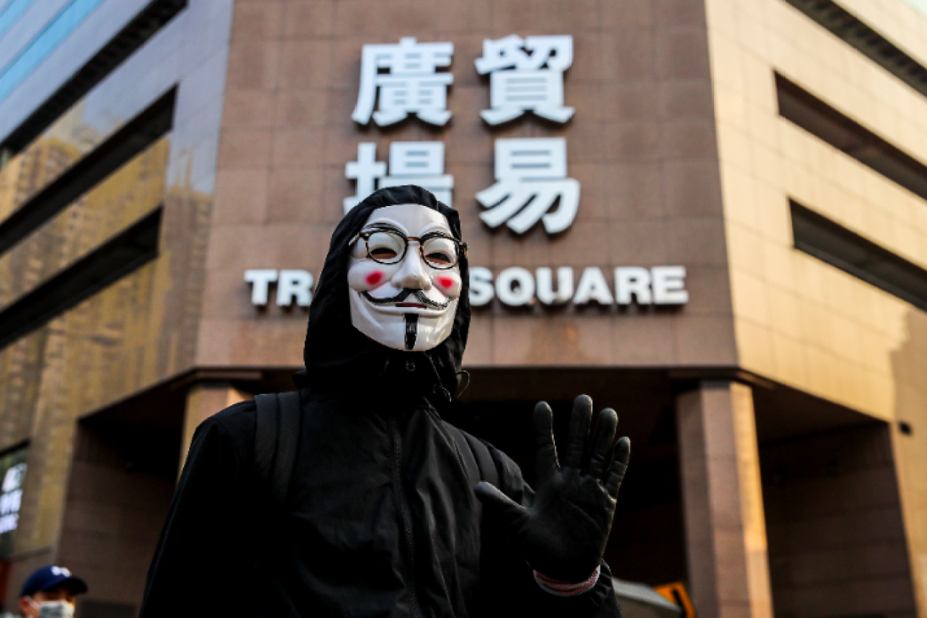 A masked protester demonstrates for democracy and free speech amid the turmoil of Hong Kong.