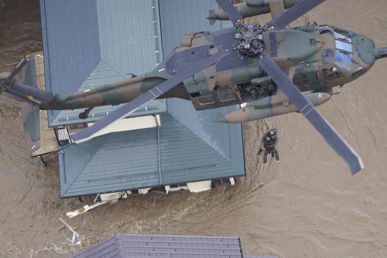 Japan has deployed troops, police, fire fighters and the coast guard in a massive rescue operation after Typhoon Hagibis. 