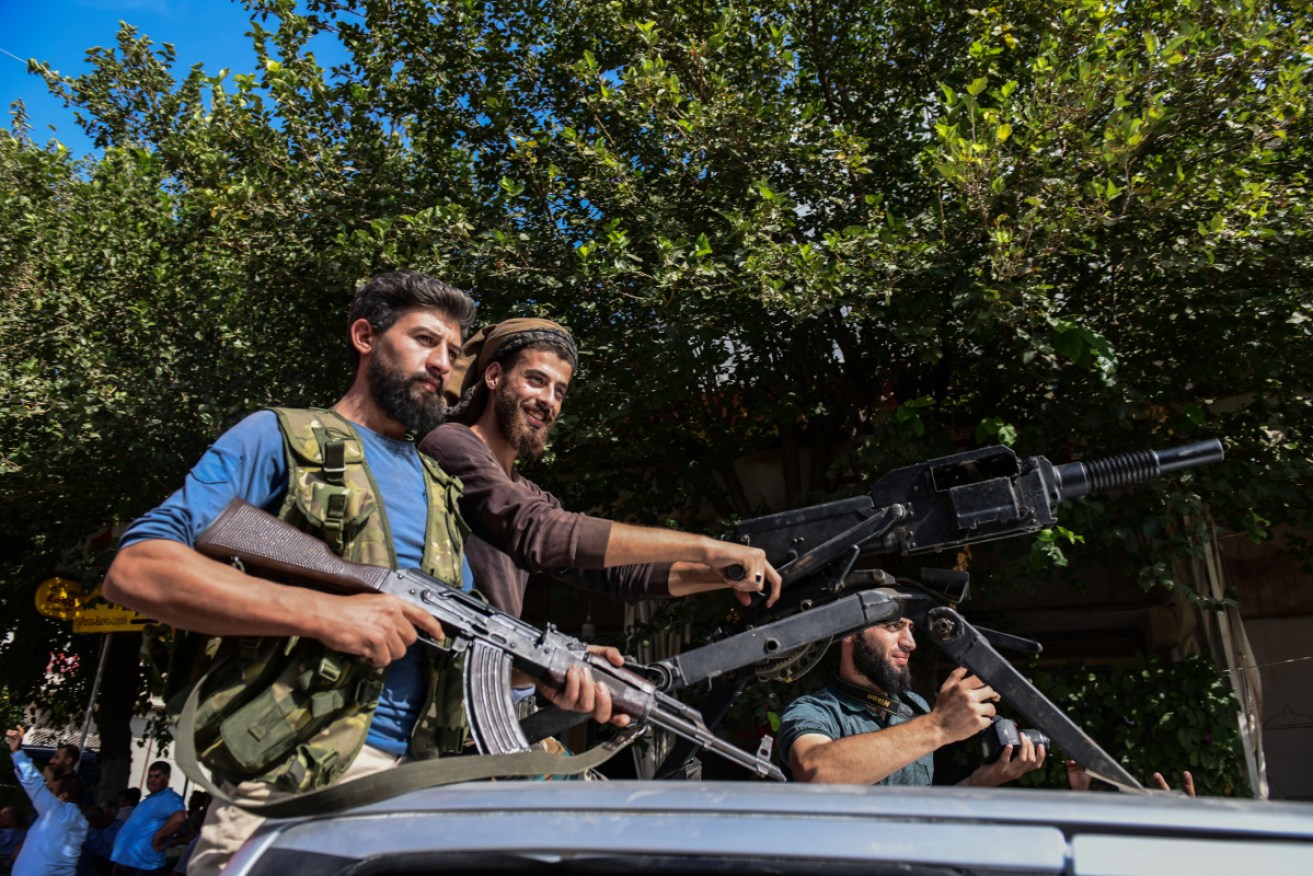 Members of Turkish-backed Free Syrian Army, a militant group active in parts of northwest Syria, heading toward Syrian town of Tal Abyad.
