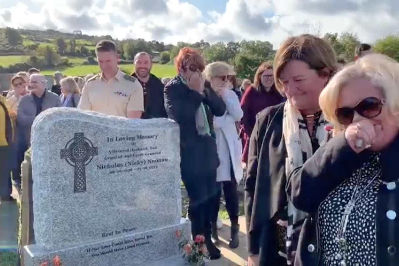 Mourners gathered by an Irish grandfather's graveside burst out into laughter during his prank from beyond the grave.
